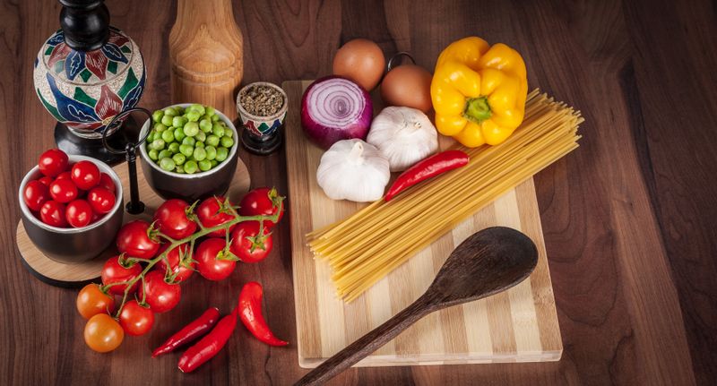 Fresh vegetables and ingredients arranged for healthy cooking